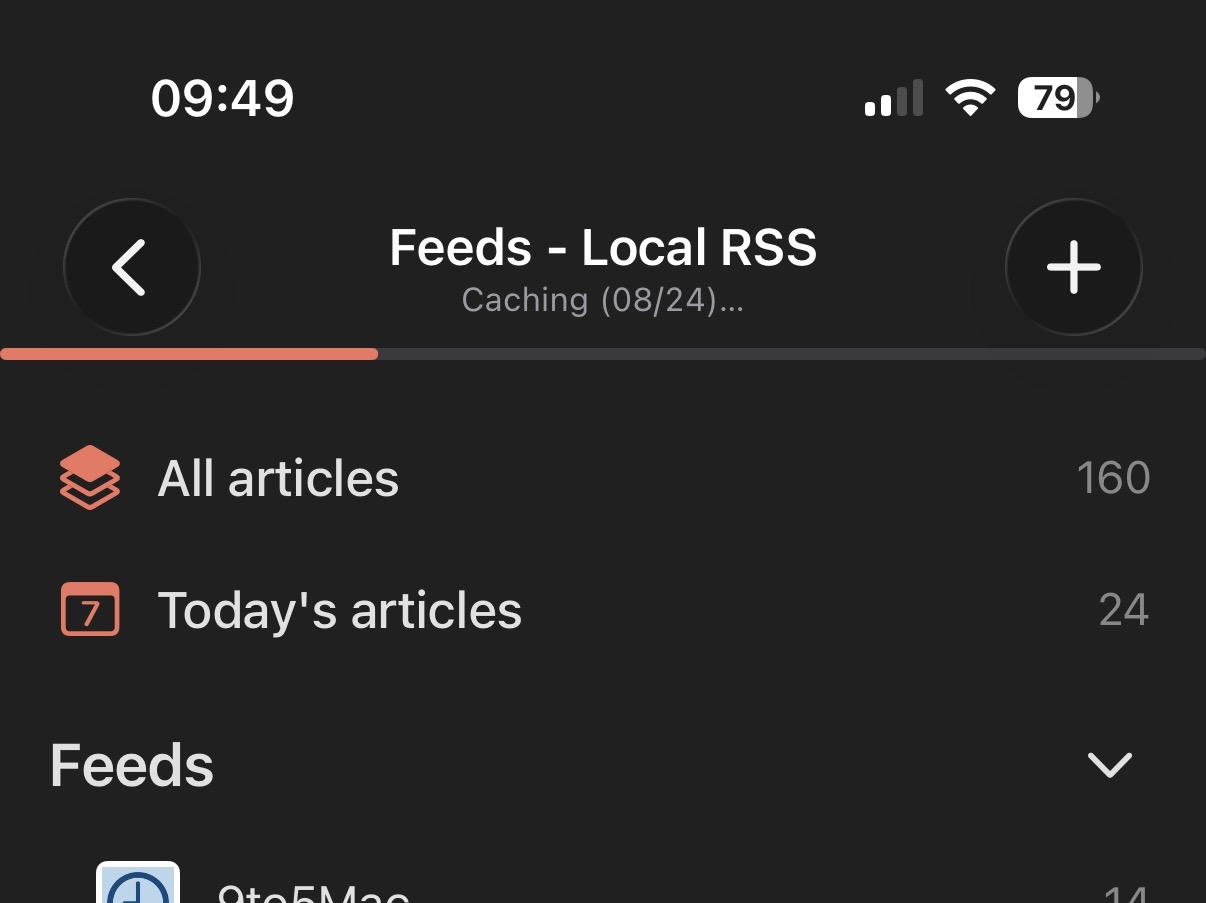 Feedler's Feeds list with a caching progress bar at the top, running as the app opens